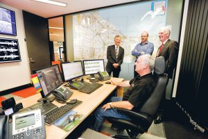 Checking the Peninsula Link control centre and one of its operators, above, are Linking Melbourne Authority chief executive Ken Mathers, left, Lend Lease general manager Philip Naulls and Nepean MP Martin Dixon (Picture: Yanni)