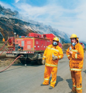 Mine fire: Somerville firefighters Dave O’Brien, left, and Jake Sanders take a break from firefighting in the open cut coal mine next to the Hazelwood powers station at Morwell.