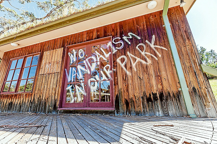 Paint attack: The derelict bottom station of the former Arthurs Seat chairlift has been daubed with anti-gondola slogans. Building owner Parks Victoria is demolishing the building this week Picture: Yanni