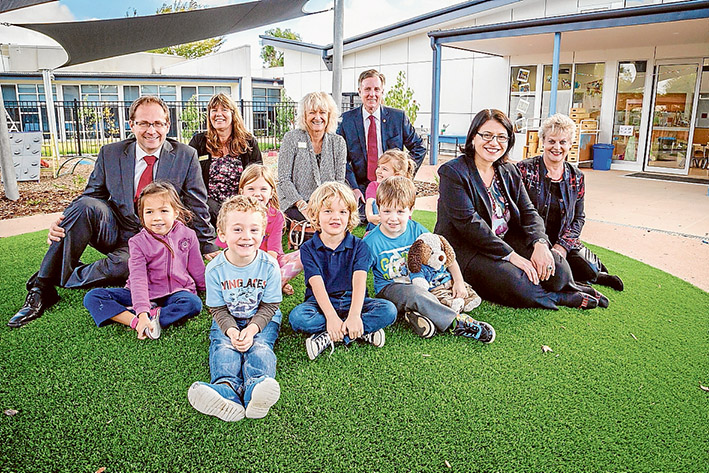 Good start: At the official opening of the expanded Bentons Square Kindergarten were upper house Labor MP Daniel Mulino, left, Cr Anne Shaw, the mayor Cr Bev Colomb, Liberal MP for Mornington David Morris, Labor’s Minister for Families and Children Jenny Mikakos, and Biala Peninsula CEO and Community Kinders Plus chairwoman Marlene Fox with children of the Dragonflies group. Picture: MP Shire