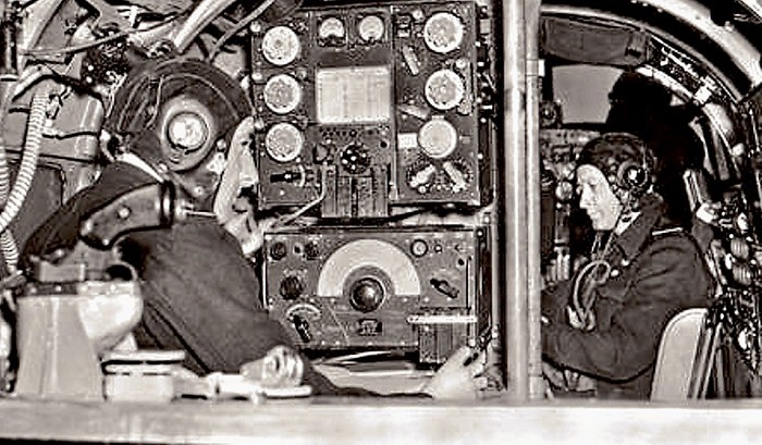 The wireless operator and navigator inside the Lancaster.