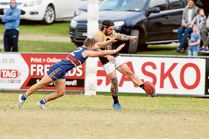 No quarter given: Mornington got up over Frankston YCW in a low-scoring affair at the weekend. Picture: Gary Bradshaw