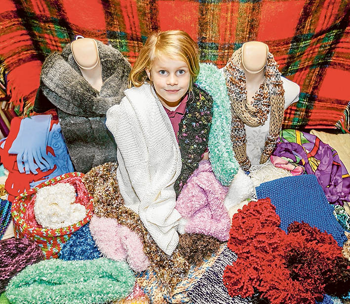 Good cause: The scarf stall makes a colourful and cosy backdrop for generous Isabelle Stanley. Picture: Yanni