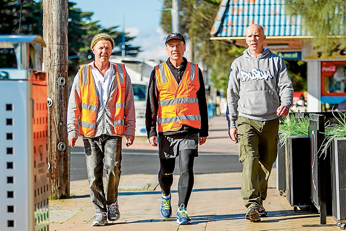 Respect: Australian Greens convener on the peninsula Malcolm Brown with federal Flinders MP Greg Hunt and Derek Fagan, of Statewide Autistic Services at Rye last Thursday, where the Greens donated to Mr Hunt’s Walk for Autism fund. Picture: Yanni