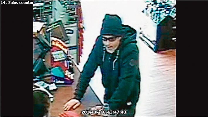 Caught on film: A still image of the man police with to speak to about the liquor outlet robbery. 