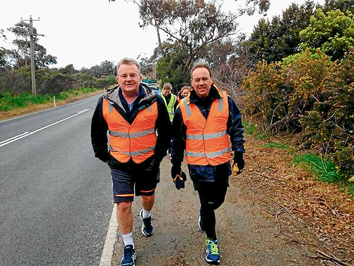 The at odds couple: Liberal cabinet colleagues Bruce Billson, left, and Greg Hunt, pictured on Mr Hunt’s 500km sponsored Walk for Autism last month, favour different paths on the legalisation of same-sex marriage debate. Pic source Twitter