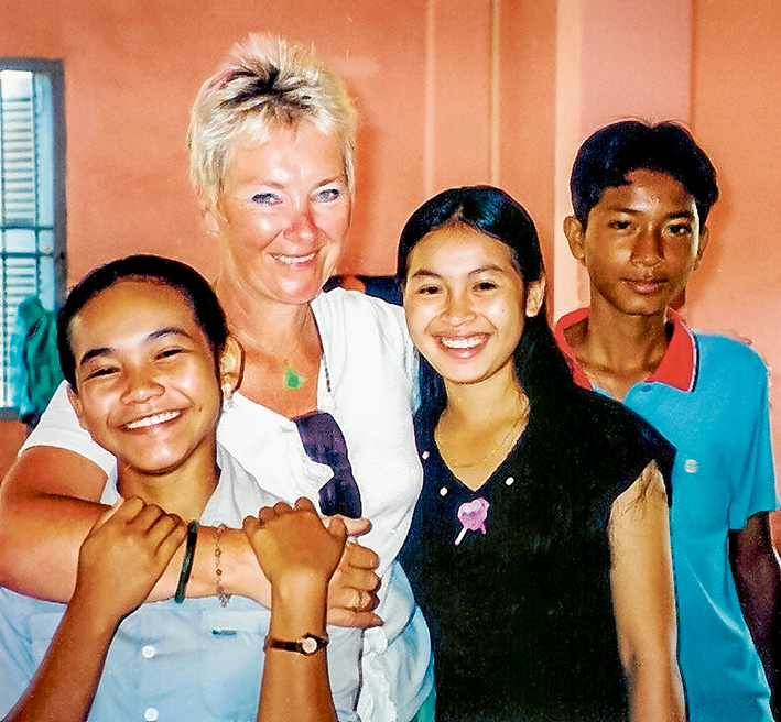 Just like mum: Gaye Miller in a Siem Reap (north-western Cambodia) orphanage with Mophay and Proling. She paid for their education, took them on holiday to the seaside, and has paid for medical bills and living expenses.