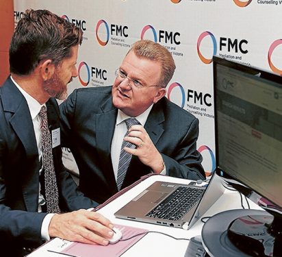 We can work it out: FMC executive manager Graeme Westaway, left, and Dunkley Liberal MP Bruce Billson at the launch of the financial first aid app in Frankston. Picture: Andrew Lloyd