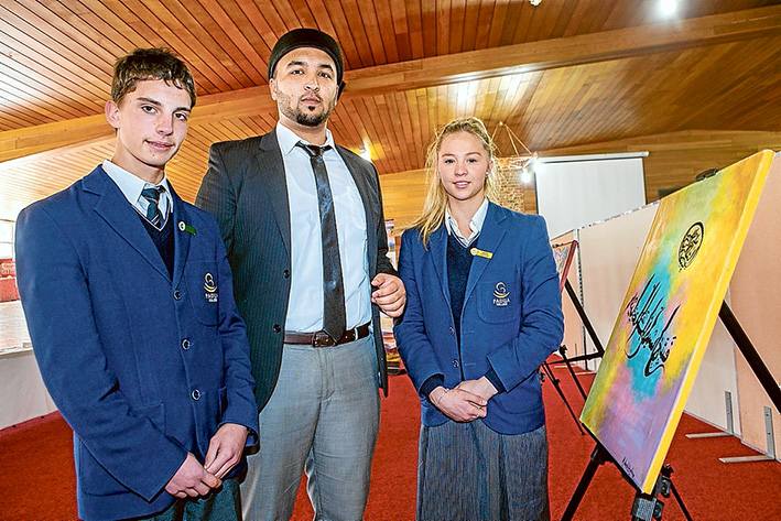Faith talks: Padua College students James Beard and Saskia Kalkbrenner with Iman Syed Wadood Janud at the Bait-ul-Salam Mosque, Langwarrin. Picture: Gary Sissons
