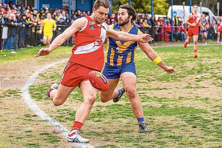 Pressure football: Somerville resisted a late charge from Sorrento to record a seven point victory. Picture: Andrew Hurst