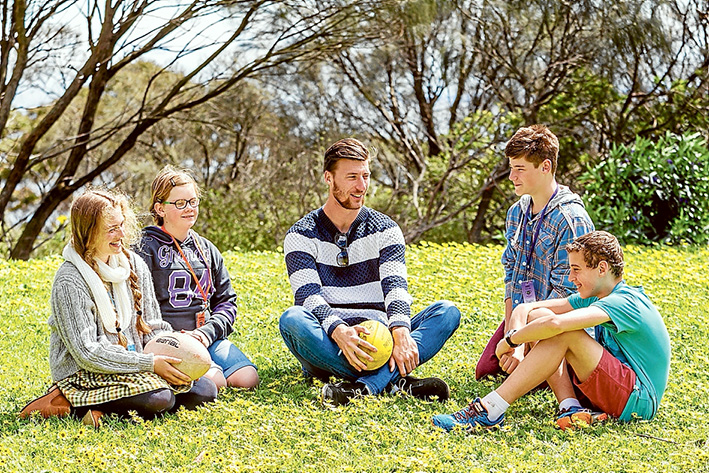 Nothing they can’t do: Billie, Imogen, Ben and Caleb talk with former AFL player Jack Fitzpatrick. All are living with type 1 diabetes. Picture: Yanni