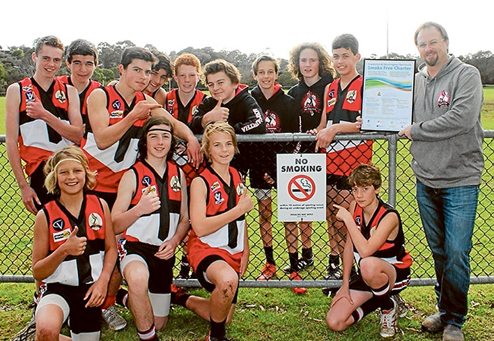 Strong message: Mt Martha Junior Football Club members proudly show off their smoke-free charter.