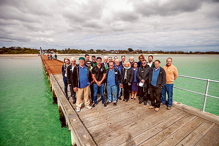 Wooden you know: Nepean MP Martin Dixon, shire mayor Cr Bev Colomb, area councillors Antonella Celi, David Gibb and Graham Pittock, shire staff, Parks Victoria staff, pier contractors and members of Pines Men’s Shed were among those celebrating the official opening of Rosebud pier last Friday. Picture: Yanni