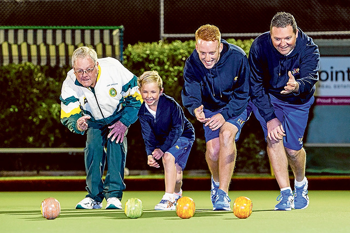 Family style: Grandfather John Gregson, seven year old Jett Simmons, Stepson Dylan Fisher and father Todd Simmons bowl at Mt Eliza Bowls Club season launch. Picture: Gary Sissons
