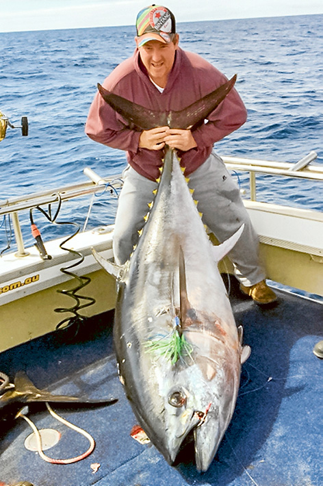 Record haul: Mornington angler Aaron Crocombe couldn’t hide his smile when he landed this possibly-record-breaking blue fin tuna Wednesday. 