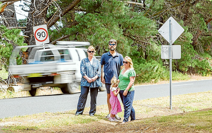 Too fast and too furious: Shelley and Robin King, Leonie Clark and daughter Gwen, want the speed limit on Davies Rd, Bittern, cut to possibly save lives. Left: the latest car to leave the road leading to the Navy’s training base, HMAS Cerberus. Pictures: Yanni 