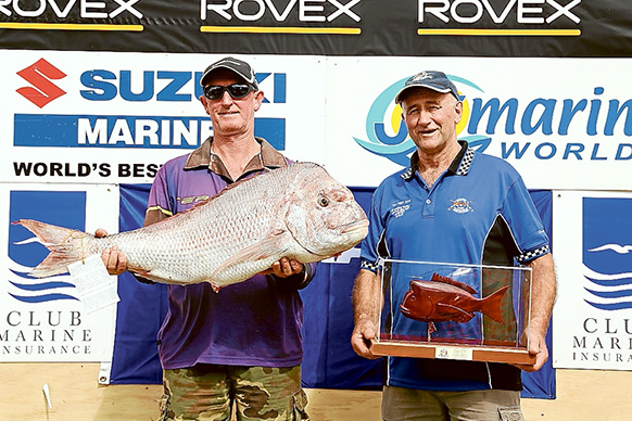 New champion: John Close’s 12.07 kilogram snapper in this year’s Snapper Point Angling Club’s Tea Tree competition earned him the state titles. He is pictured, left, with Theo Hatzis who came second with a 10.11kg fish. 