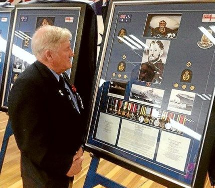 Heroism recognised: VC winner Keith Payne inspects the George Cross display.