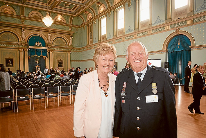 Job well done: Wayne Etcell and partner Dawn Tonge at Government House after receiving the Metropolitan Volunteer of the Year – Dame Elisabeth Murdoch Award. 