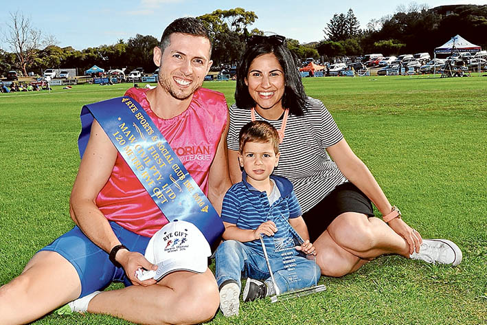 Picture perfect: Noddy Angelakos celebrates his victory in the Gift in five-star weather with his family. Picture: Barry Irving