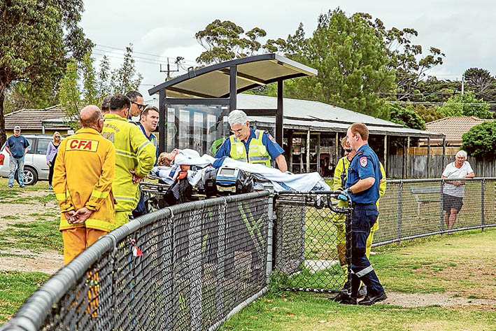 Locked out: Paramedics were forced to carry an injured Baxter woman to a waiting air ambulance because no keys were available to open gates for them to drive a vehicle onto the Fruitgrowers’ Reserve, Somerville. Picture: Gary Sissons