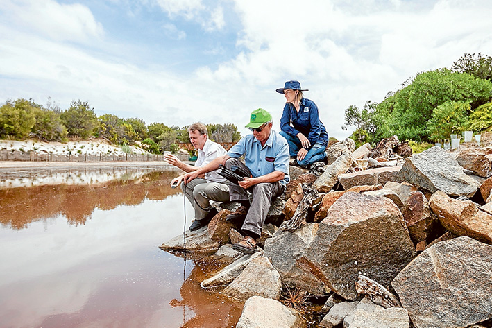 Gassed up: Mornington Peninsula Shire’s senior environmental health officer Peter O’Brien, Geoff Hall, of Estuary Watch and Joanne Thom, of Melbourne water, monitor hydrogen sulphide gas levels in Merricks Creek. Picture: Yanni
