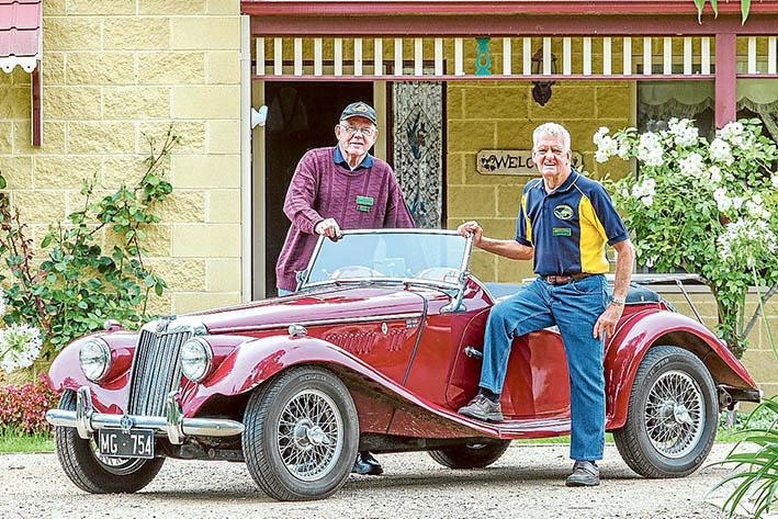 Lure of the road: RACV Great Australian Rally organiser Len Butcher and Ben Mayne prepare Ben’s 1954 MG TF roadster for last year’s rally. This year Len will drive his “Green Monster” – a 1951 Series 1 Vanguard.