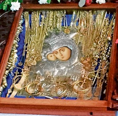 Items found: The Virgin Mary icon and pieces of jewellery found after being dumped on the side of the road.