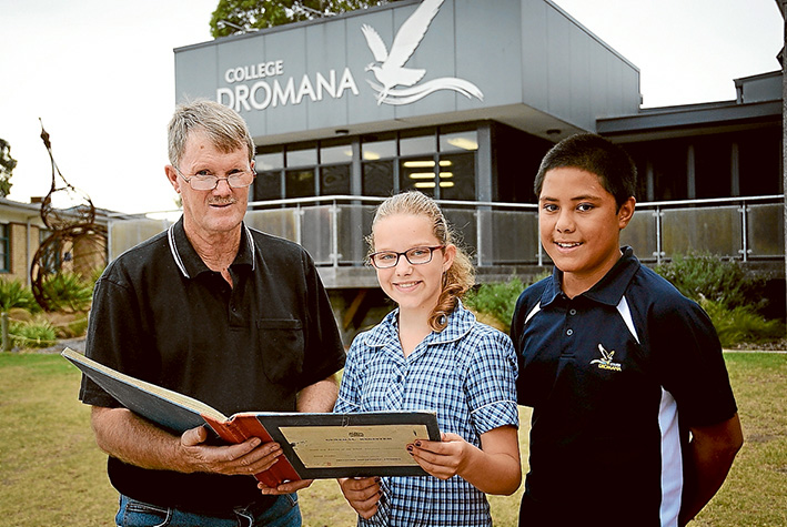 Then and now: Dromana College Year 7 students Kate Ellis and Mark Meafau, both 12, with the school’s first pupil, Trevor Birch. Picture: Derry Caulfield
