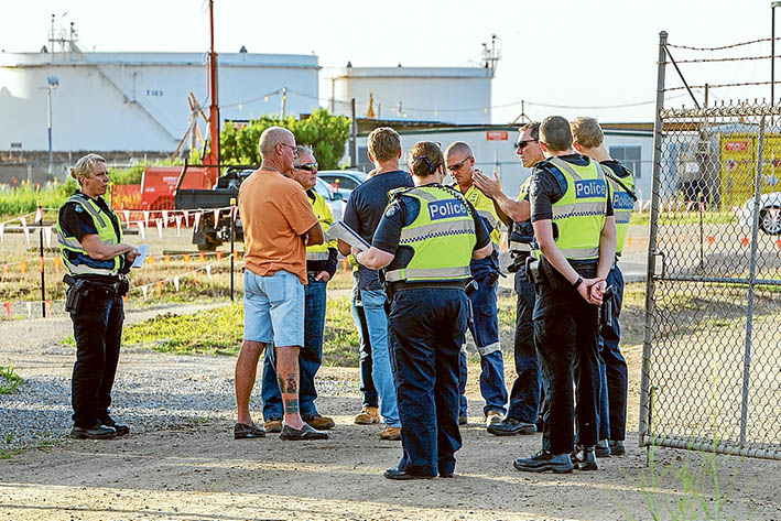 Line in the sand: Police and picket-line organisers outside the gates of United Petroleum Hastings, last week. Picture: Gary Sissons