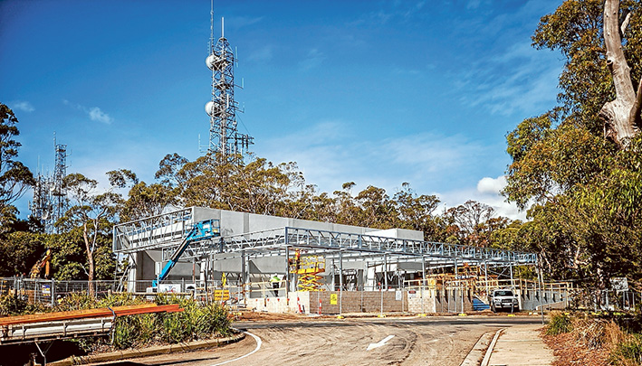 Shaping up: Despite some ongoing planning hurdles, Skylift infrastructure continues to be built at Arthurs Seat, including the top station, above, and, top, clearing for pylons which will hold cables along which the gondolas will run. Pictures: Yanni