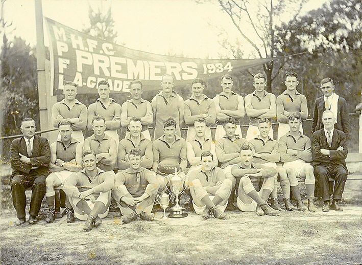 Hastings Football Club premiership team of 1934: (Back row) J. A. McMillan, R. L. Clarke, J. E. Unthank, E. W. Fisher, A. J. Heggen, H. W. Hodgins, N. K. Jones, C. Tolson, G. Parscisson (Trainer). (Middle row) H. Hoddock (Secretary), F. Denham, H. Jack, G. Perrott (Vice-Captain), T. Mirabella (Captain), C. P. Perrott, G. Mirabella, R. Mentiplay, P. Wilson, T. H. Barclay (President). (Front Row) C. E. Horsburgh, B. Wilson, S. Mirabella, L. Mentiplay. (Absentees) R. L Storey, H. Porter.