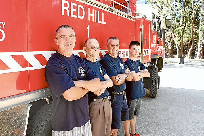 Fire ready family: Red Hill volunteer firefighters Anthony, Roy, Darrel and Lachlan Setter beside the big red truck. Picture: Raelene Gard, of District 8.