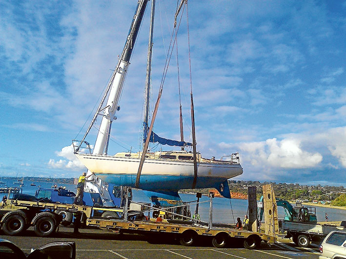 Yacht gets a lift: WILD weather washed Cavalier 37 yacht Lucinda onto the beach at Mornington on 27 May – the second yacht to be beached that month. But help was quickly at hand. Two cranes were hired to pick her up and carry her along the beach to the car park near the yacht club. There, a 40-tonne hoist lifted her onto a low loader and into a cradle on the hard stand. Pictures: Gordon Barrow 