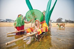 Novel approach: Former Mt Martha author and therapist Bernadette Hoey takes a dip for her 80th birthday helped by Anne Norman and Ian Cuming. Picture: Yanni 