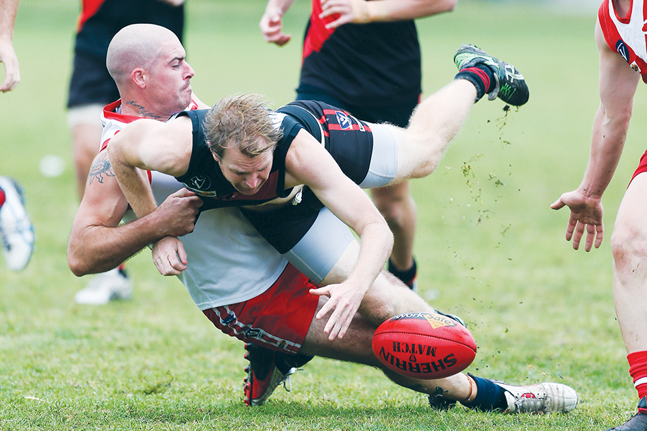 It’s (almost) on: Karingal and Frankston Bombers got to grips with the reality of a new football season in a preseason game on Saturday. Picture: Gary Bradshaw