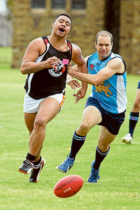 Shoulder to shoulder: Cerberus captain Torben Louwen-Skovdam and St Kilda’s Elijha Salesui make a contest of it.