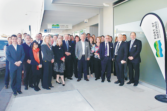 Boom times: Less than one year ago the expanding team of staff at the Port of Hastings Development Authority was celebrating the leasing of new offices in High St, Hastings. They were joined by Hastings MP Neale Burgess (who unveiled a plaque inside the offices), standing third from right with the authority’s CEO Mike Lean. This week staff numbers are down to 14 and most of the office space will go unused. Picture: Gary Sissons