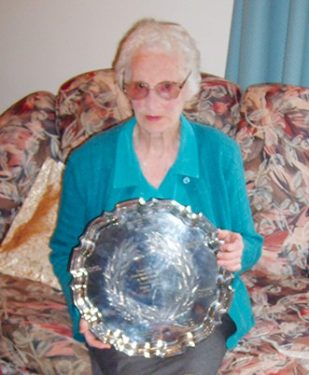 Above: Eileen at 95 with the tray presented to Norm on completion of 50 years of service to the Hastings Football Club