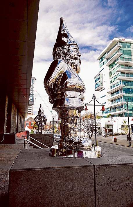 Gnome alone: A huge 9-metre stainless steel gnome sculpture similar to the two above, left, at the Christchurch Art Gallery in New Zealand will soon keep watch over Peninsula Link. The sculpture will replace the much-loved Tree of Life sculpture, right, at the Cranbourne Rd exit of the freeway. Tree of Life pic: Gary Sissons