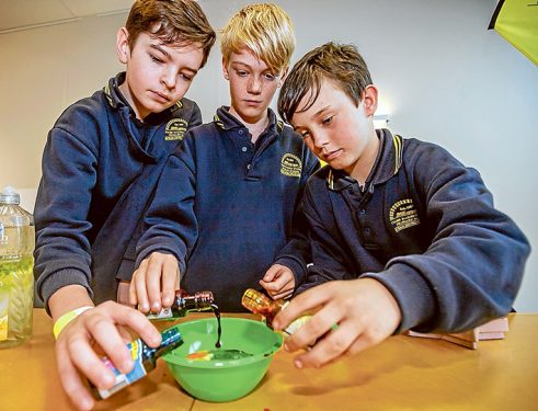 Brendon, Aaron and Jake from Tyabb Railway Primary School demonstrate their coloured water droplet experiment. 