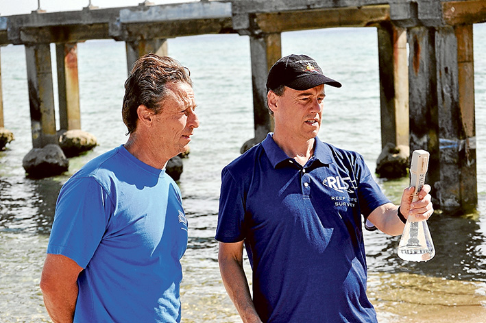 Testing time: Greg Hunt and Clean Ocean Foundation’s John Gemmill show how water samples can be tested. Picture: Supplied