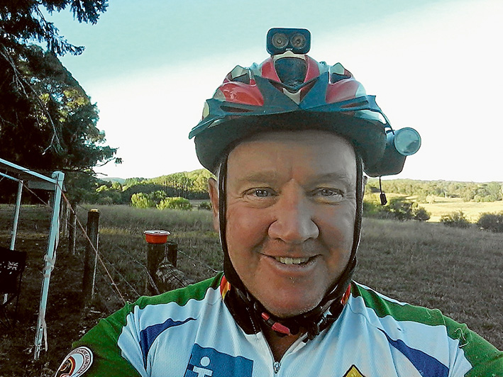 Helmet with benefits: George Paterson has fitted lights and a camera to his bike helmet to alert and monitor motorists.