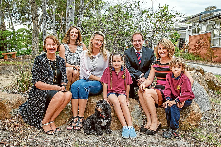 New course: Judith Couacaud Graley, Kath Lord, Jasmine Kennedy, Daniel Mulino, Beverly Dadds and pupils Josie and Joshua at Mornington Park Primary School for the announcement of a mentoring program. (The dog Pepe is the school’s therapy dog) Picture: Gary Sissons