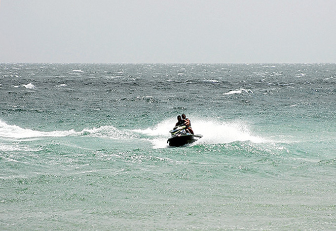 Ban sought: Mornington Peninsula Shire councillor Hugh Fraser wants municipalities to pressure the state government into banning jet skis in Port Phillip. These jet skiers are enjoying waves breaking on a sand bank at Safety Beach. Picture: Keith Platt