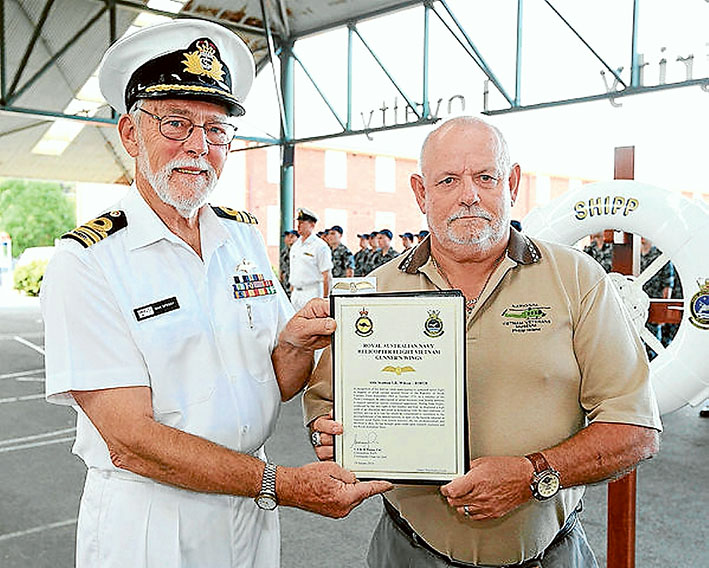 Time heals: Vietnam Veteran Able Seaman Rtd Ian Wilson receives his Helicopter Flight Vietnam Gunner Wings from Commander Max Speedy (ret), during a ceremony at HMAS Cerberus last week.