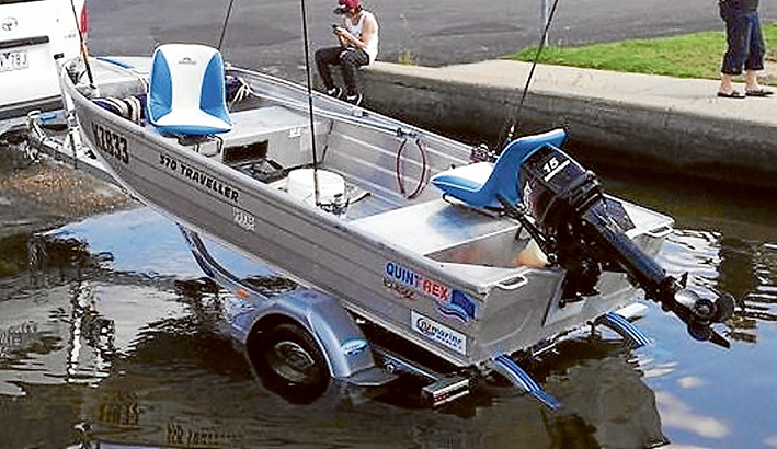 Sea change soured: The Quintrex 370 traveller with swivel chairs and 15hp Mercury outboard leaves the water at Hastings. Picture: Supplied