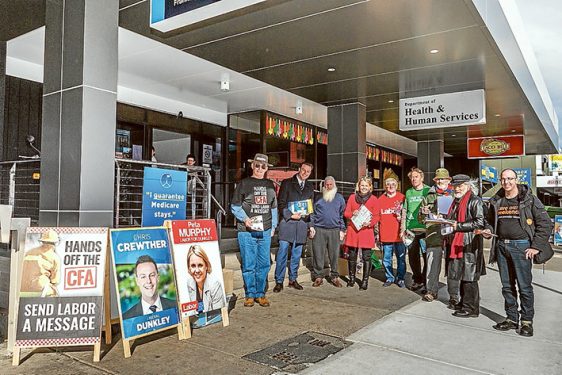 The home straight: Liberal candidate Chris Crewther, Labor candidate Peta Murphy and other political parties hand out flyers to early voters in Dunkley. Picture: Gary Sissons