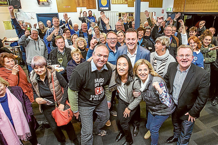 Winning call: DUNKLEY Liberal candidate Chris Crewther celebrates his likely, but not assured, victory with supporters including departing MP Bruce Billson, right, and election campaign manager Darrel Taylor who is also a Frankston councillor. Dunkley is one of 13 seats around Australia that is too close to call and it could take days or even weeks for the Australian Electoral Commission to count all votes including postal votes to determine the final outcome. Picture: Gary Sissons