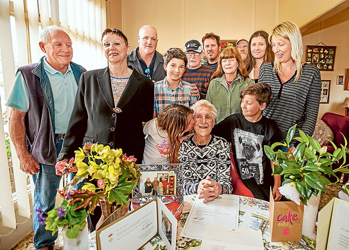 Many happy returns: Rosebud’s Thelma Appleford celebrates her 100th birthday with her brood: Gary, Jeannette, Geoff, Don, Sean, Eric, Mikaela, Bianca, Sam, Sue, Stella (kissing her), and Nick. Picture: Yanni